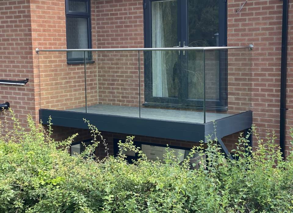Balcony with glass balustrade and stainless top rail